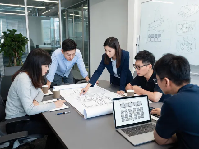 Energy project team reviewing drawings